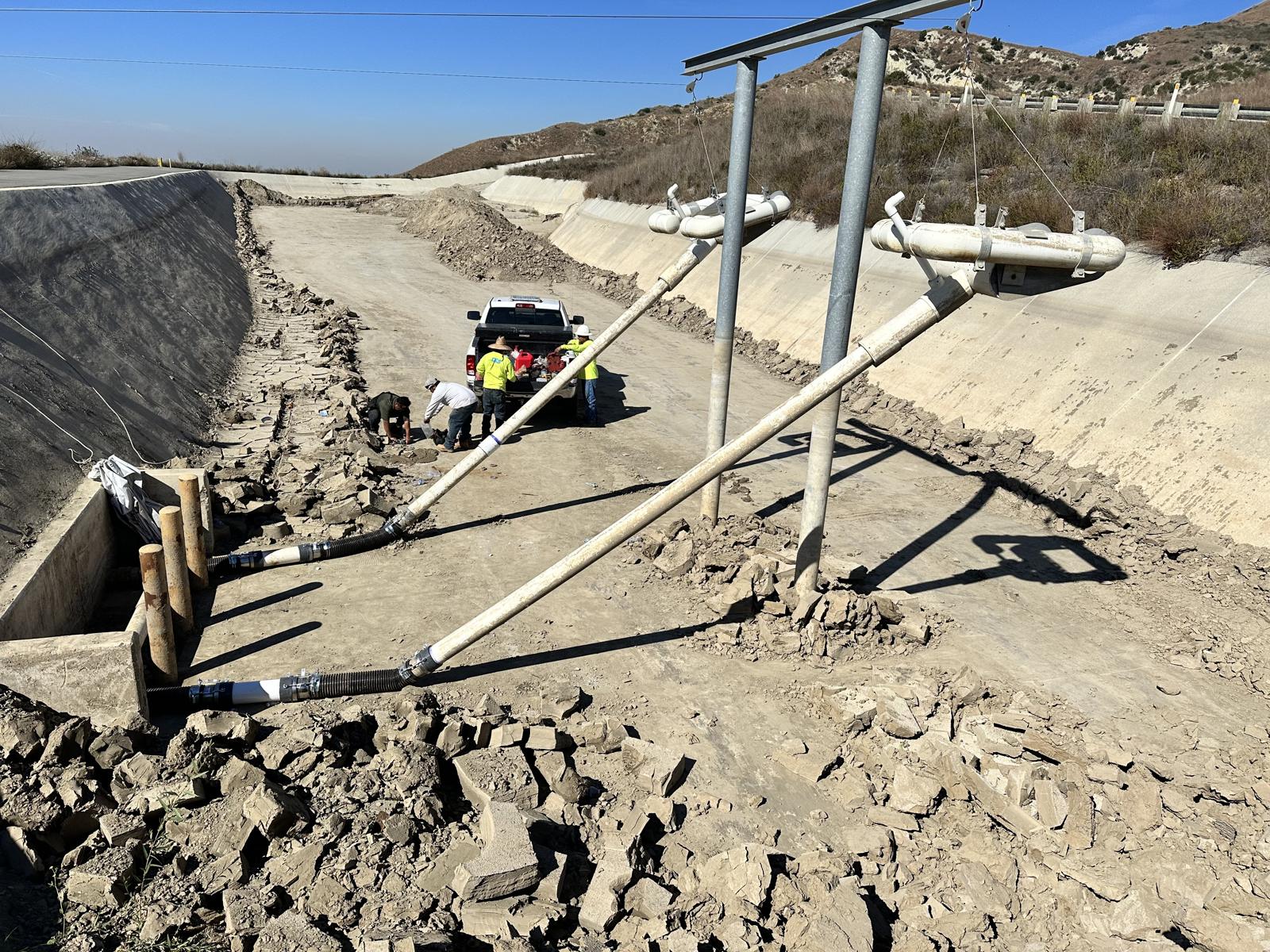 CES crew working in a landfill drainage channel